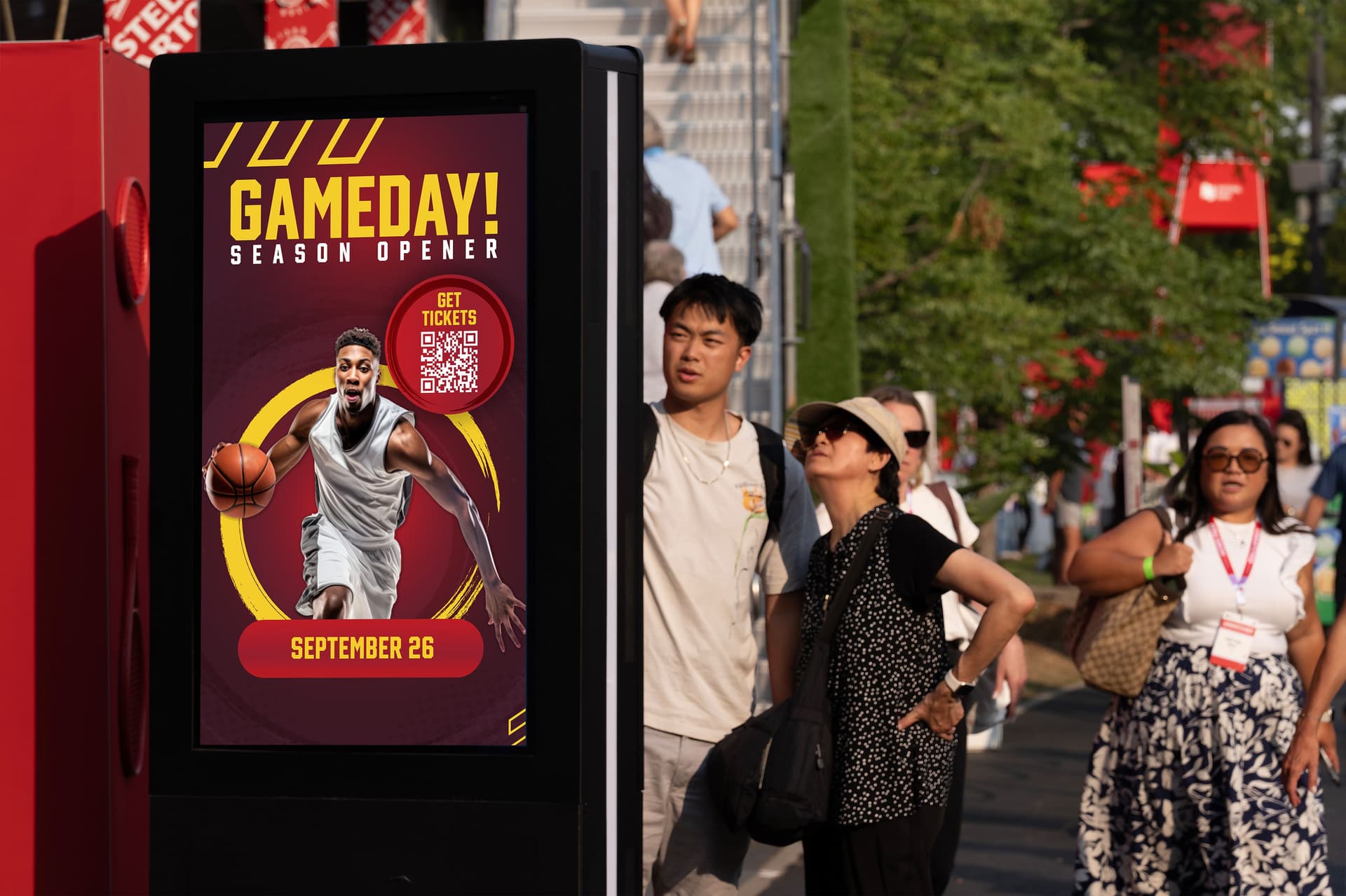 BIG Digital portable digital kiosk displaying game day promotions and QR-enabled ticketing outside a live sports venue.